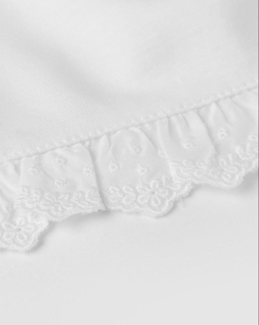 Bavoir à bandes brodées