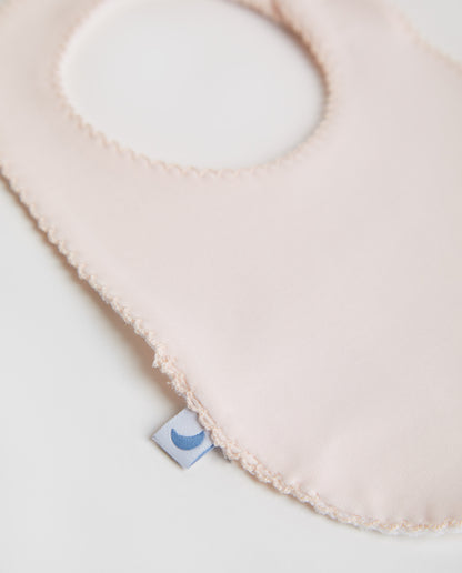 Bavoir rose